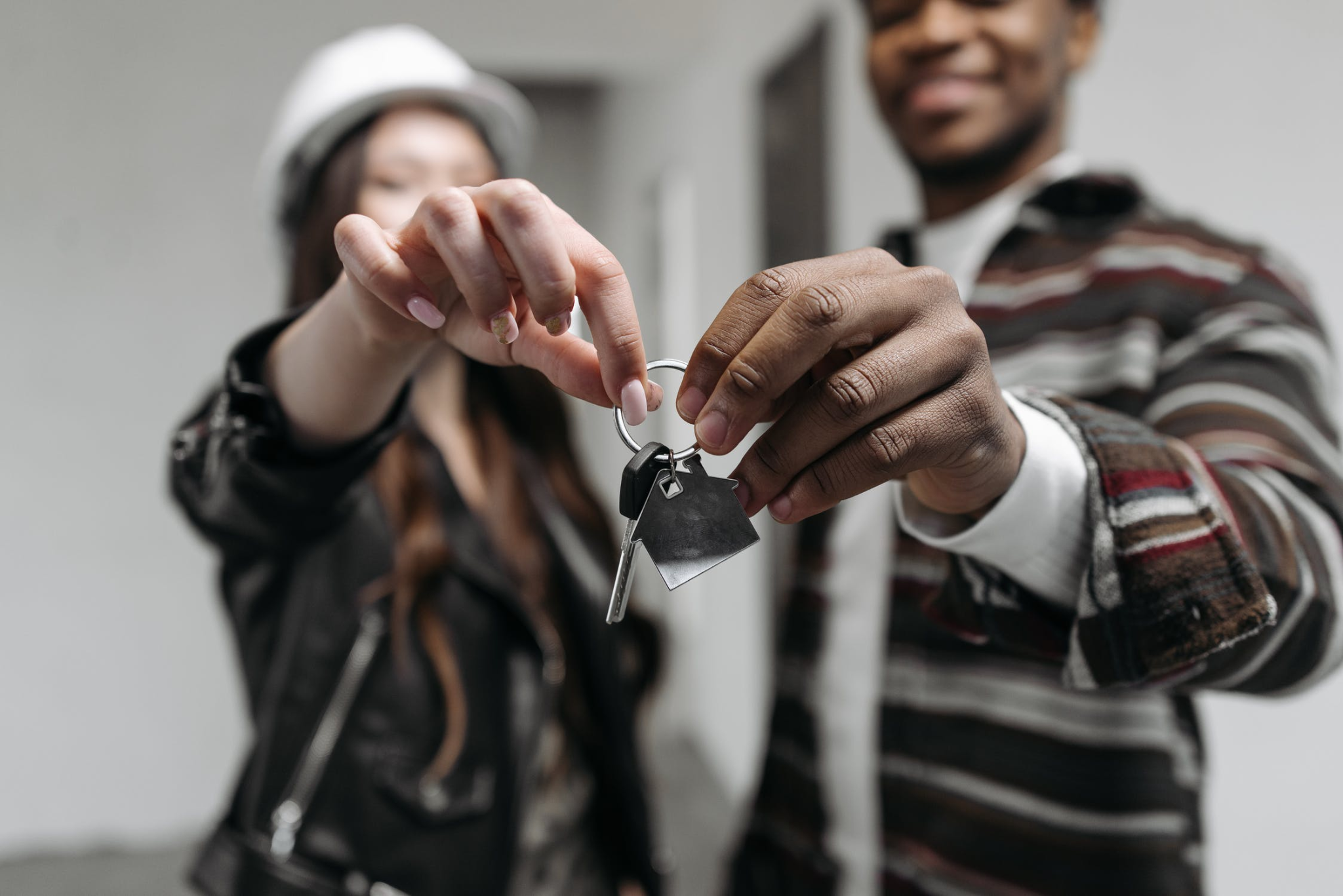 homeowner choosing a buyer and handing them keys