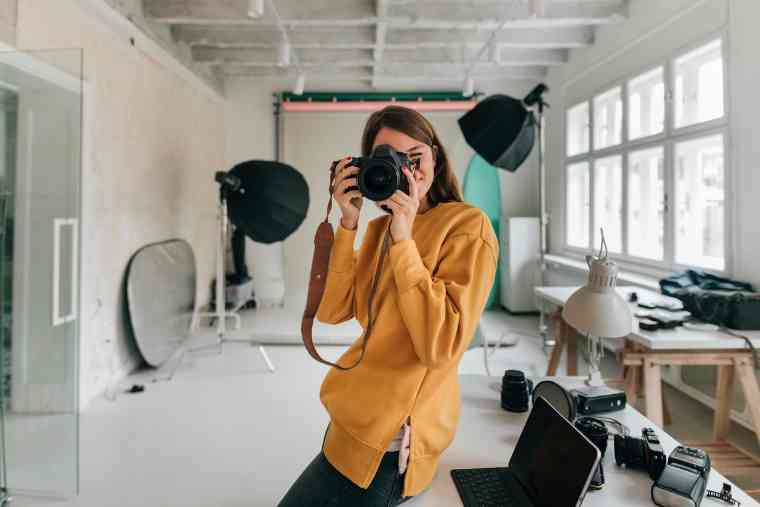 woman taking pictures of house interior