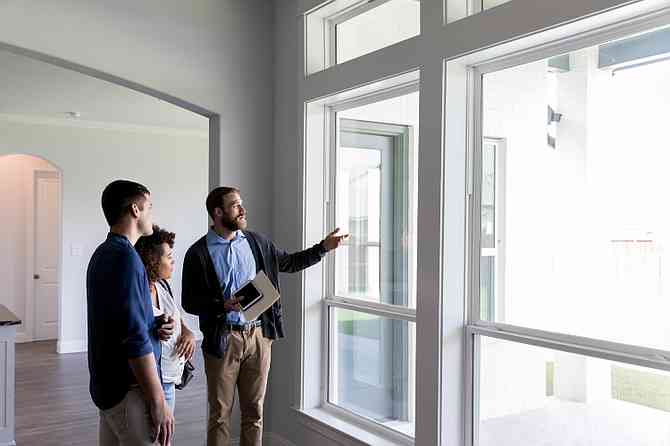 couple visiting house on sale