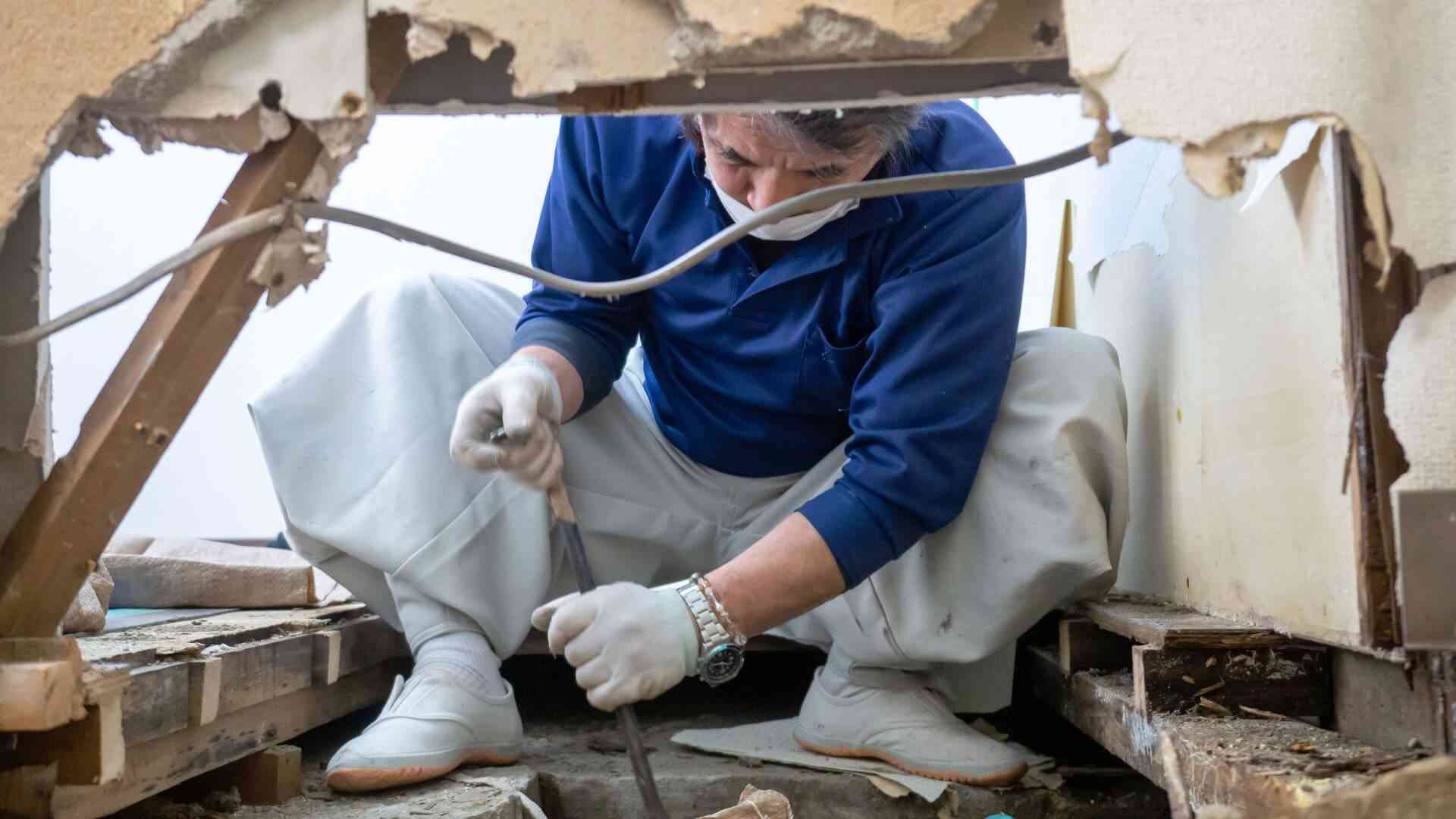 man repairing home