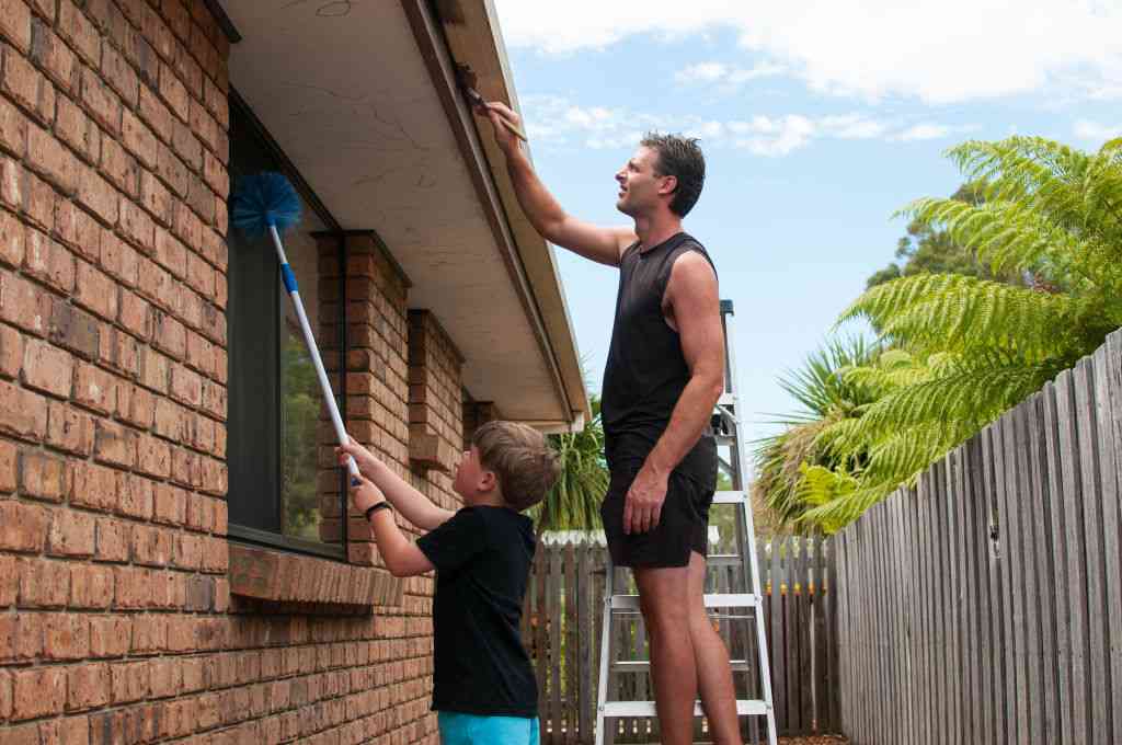 two persons fixing outdoor