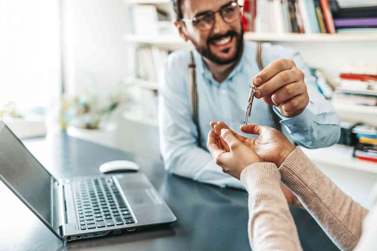 property manager handing over keys