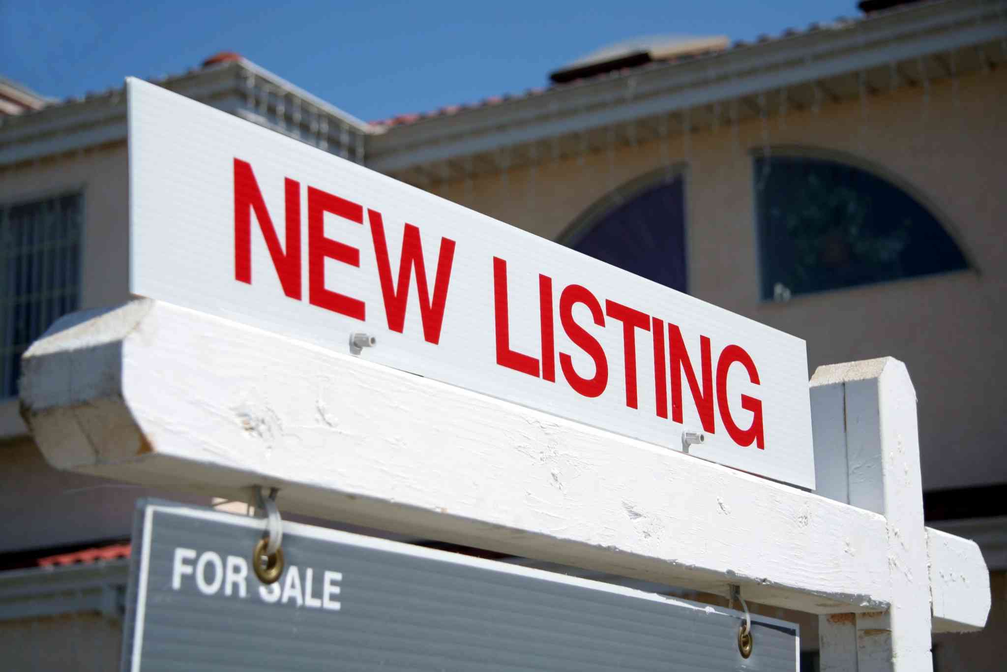 sign board showing new listing of a house