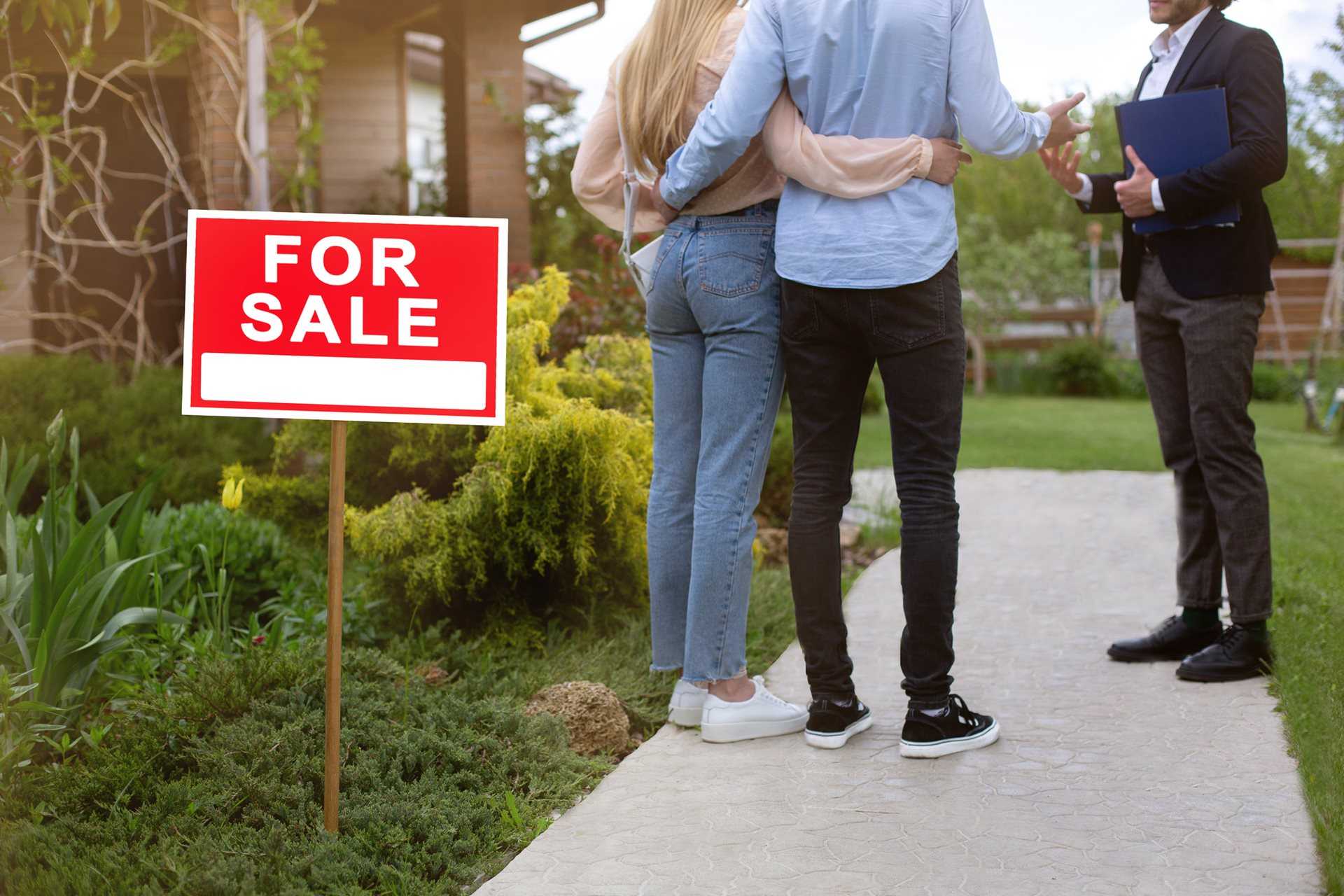 couple visiting house for sale