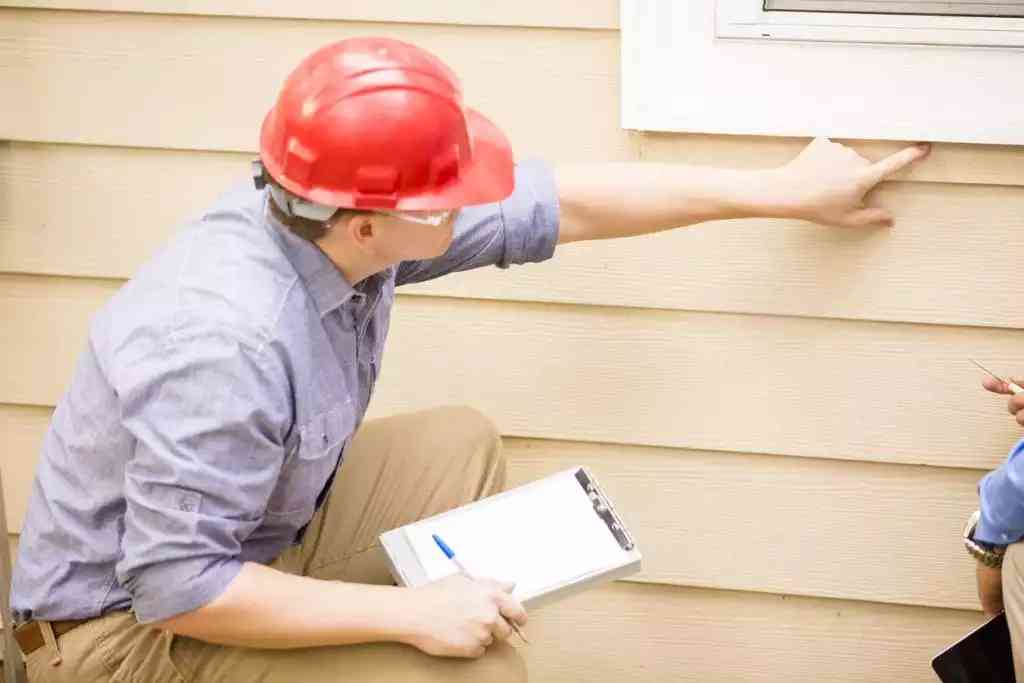 person checking for damages to get repaired