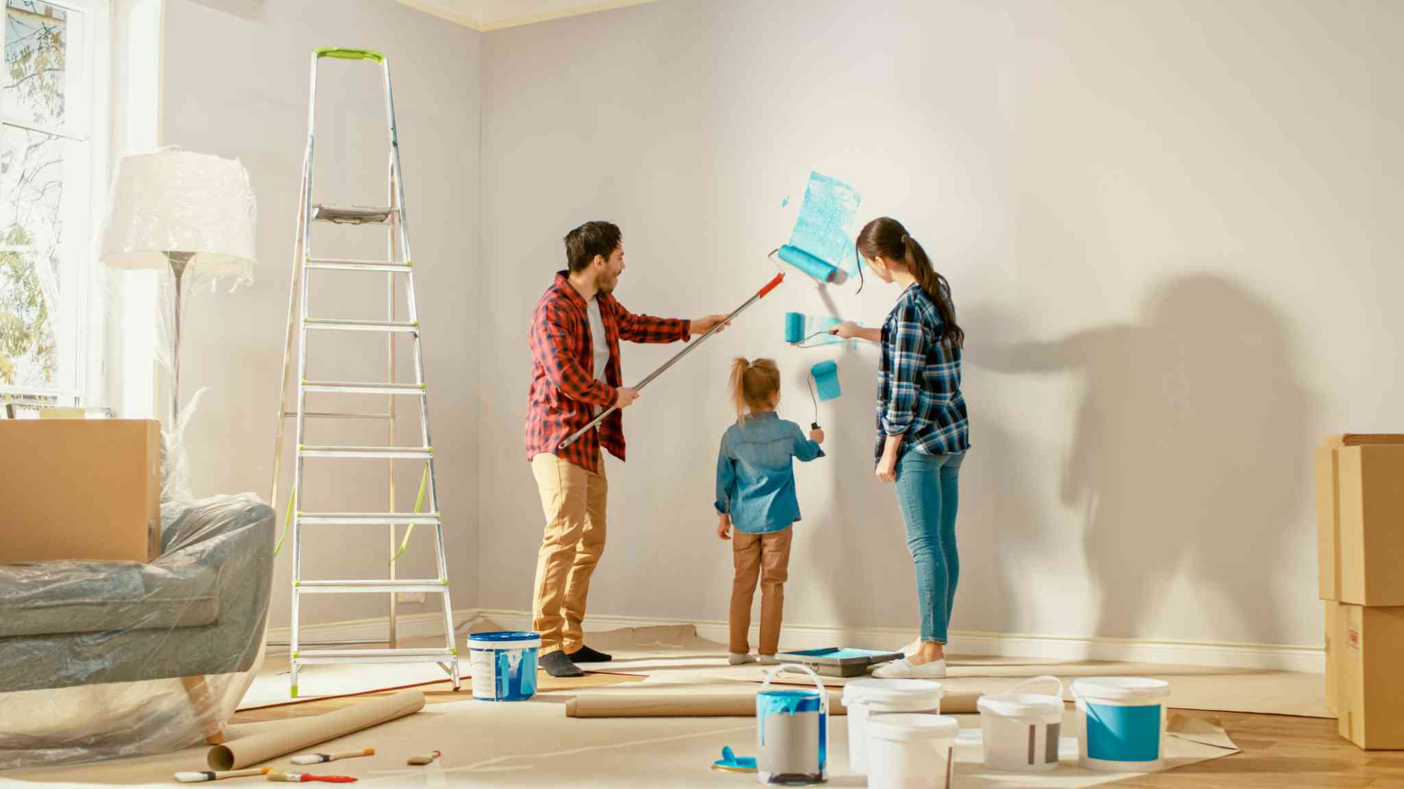 a family painting wall