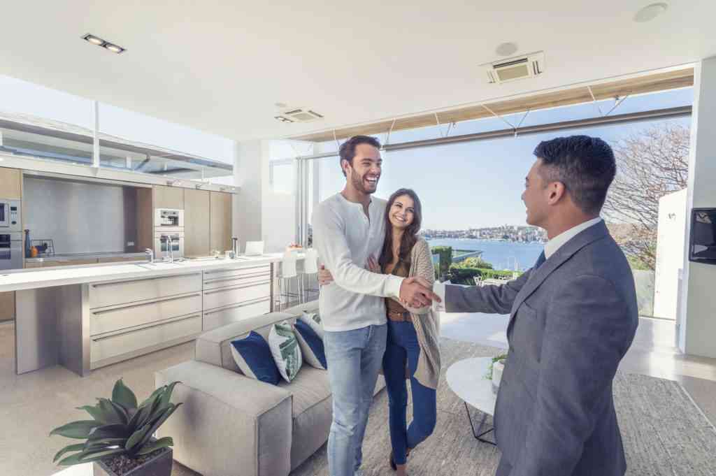 image of couple being happy with real estate agent