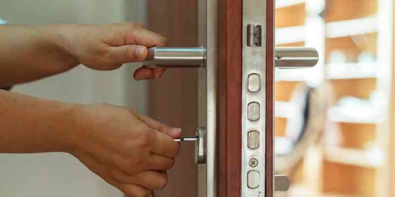 image of person checking door lock