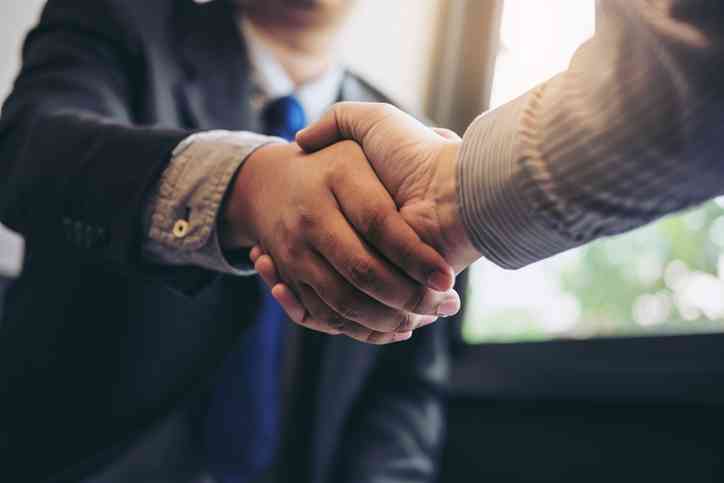 image of two person shaking hands