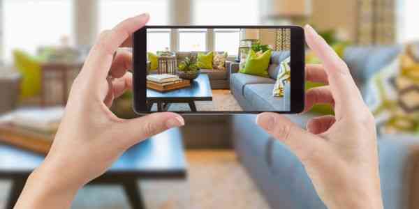 image of person taking pictures of house interior