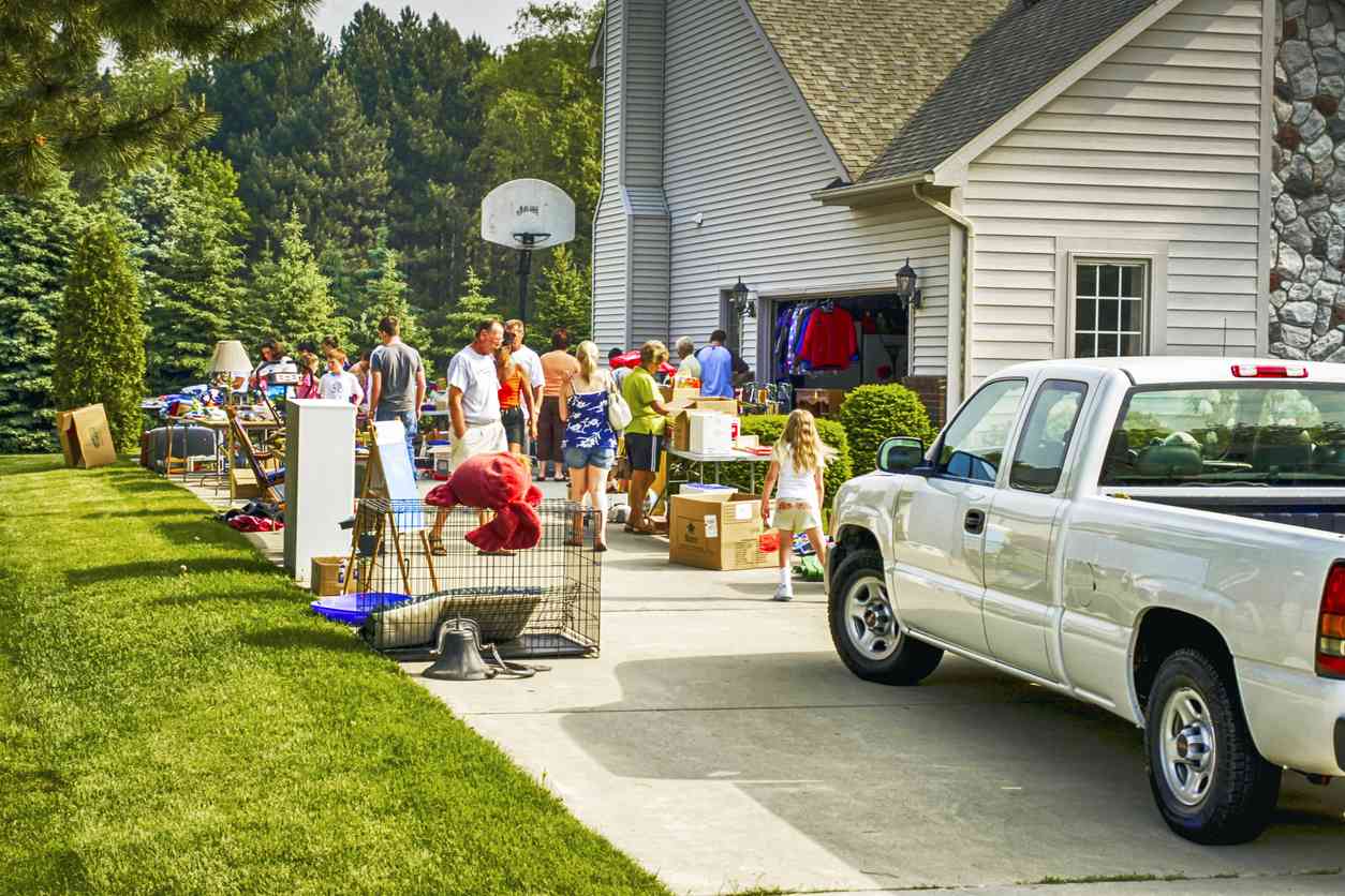 image of people gathered outside a house