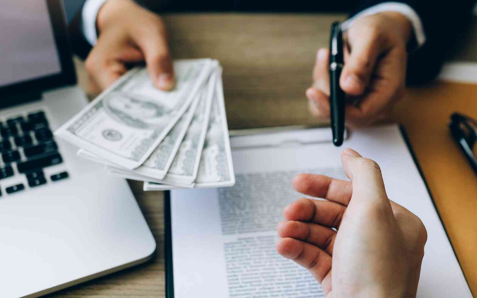 image of person paying cash against purchase